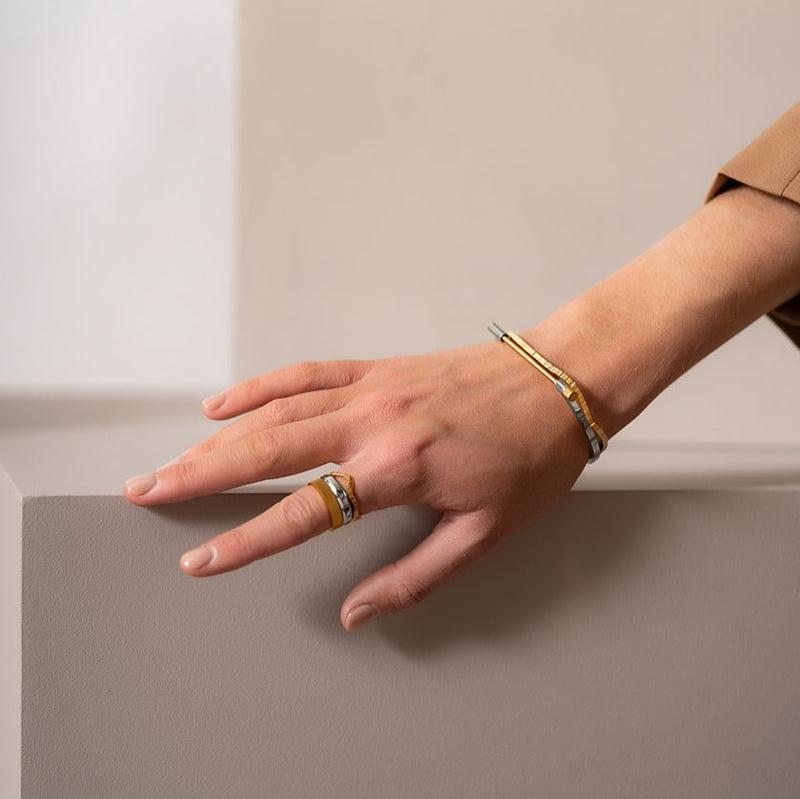 Omega Bangle, Polished Steel and Gold Plated Bracelet Skultuna